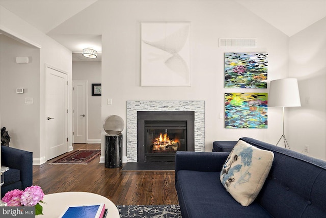 112 W Shore Dr, Milton, DE 19968 - living area with wood finished floors, lofted ceiling, and a glass covered fireplace