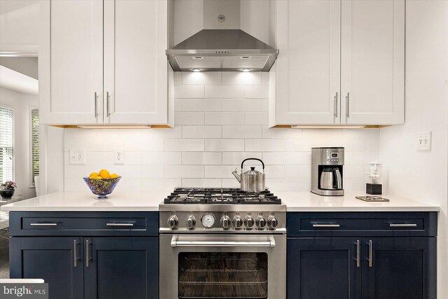 112 W Shore Dr, Milton, DE 19968 - kitchen with wall chimney range hood, high end stainless steel range oven, light countertops, and tasteful backsplash