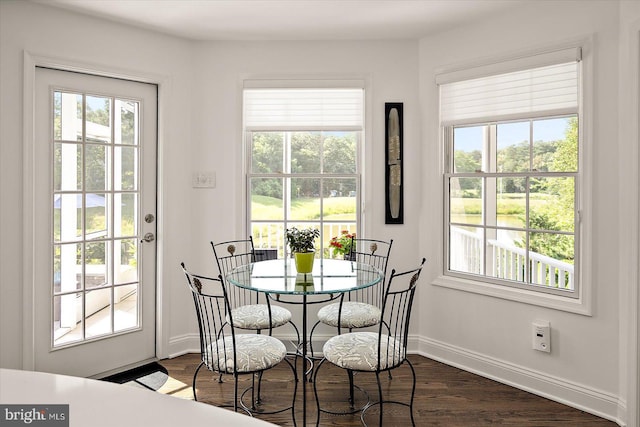 112 W Shore Dr, Milton, DE 19968 - dining room featuring dark wood-style flooring and plenty of natural light