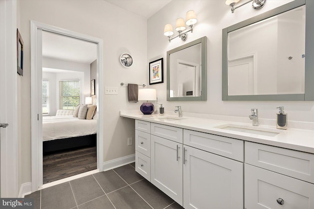 112 W Shore Dr, Milton, DE 19968 - ensuite bathroom featuring double vanity and tile patterned flooring