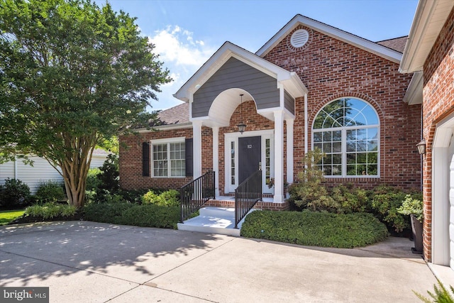 112 W Shore Dr, Milton, DE 19968 - view of front of property featuring brick siding and a shingled roof