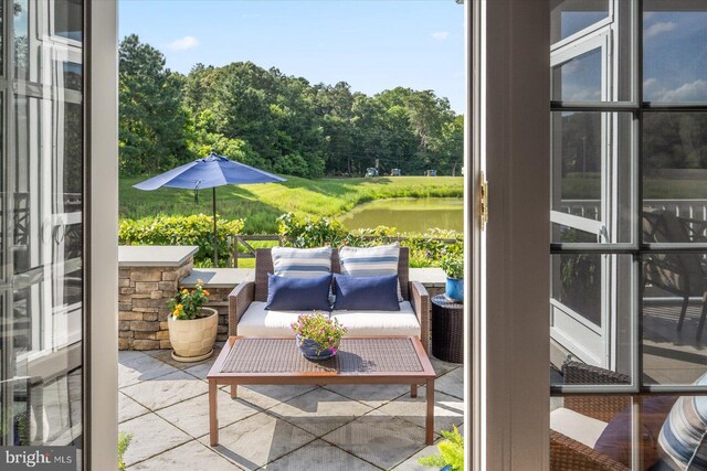 112 W Shore Dr, Milton, DE 19968 - view of patio with a water view and outdoor lounge area