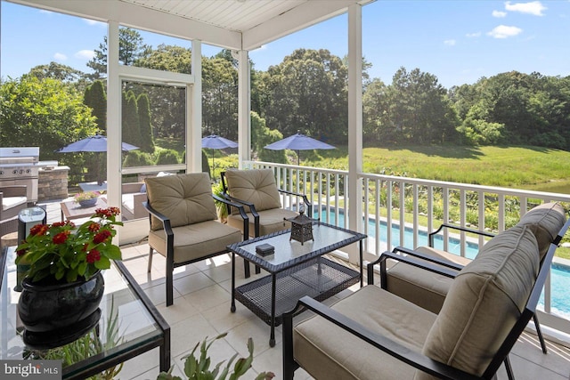 112 W Shore Dr, Milton, DE 19968 - sunroom / solarium with outdoor lounge area, an outdoor kitchen, and view of scattered trees