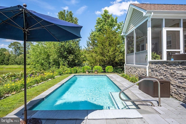 112 W Shore Dr, Milton, DE 19968 - swimming pool with a sunroom and a patio area