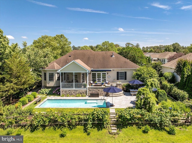 112 W Shore Dr, Milton, DE 19968 - swimming pool featuring a patio area, a sunroom, outdoor dining area, and an outdoor living space