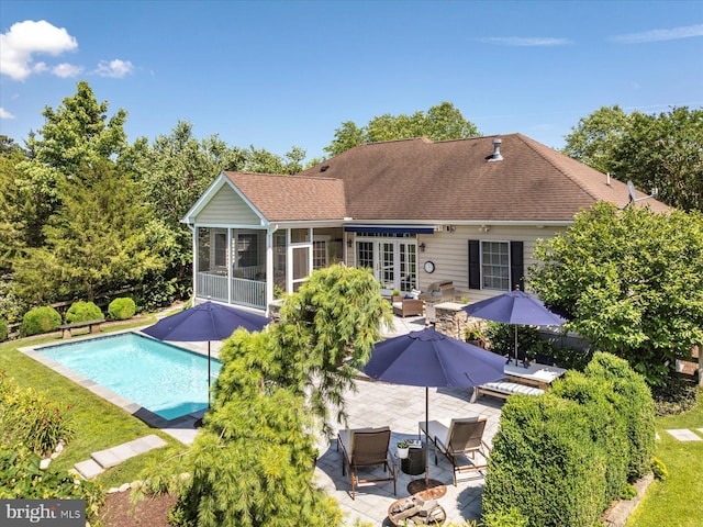 112 W Shore Dr, Milton, DE 19968 - outdoor pool featuring a patio, a sunroom, and an outdoor hangout area