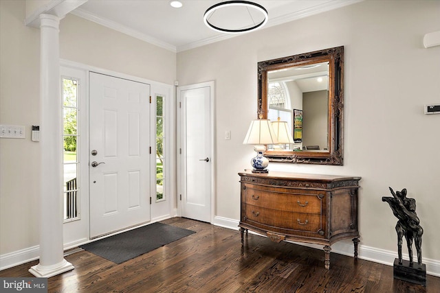 112 W Shore Dr, Milton, DE 19968 - foyer entrance featuring ornate columns, dark wood-style flooring, healthy amount of natural light, and crown molding