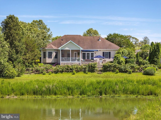112 W Shore Dr, Milton, DE 19968 - rear view of house featuring a deck with water view