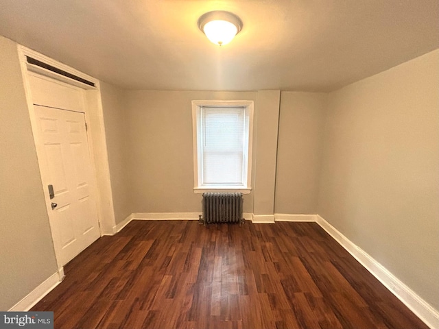 5803 Old Second St, Philadelphia, PA 19120 - unfurnished room featuring radiator and dark wood-type flooring
