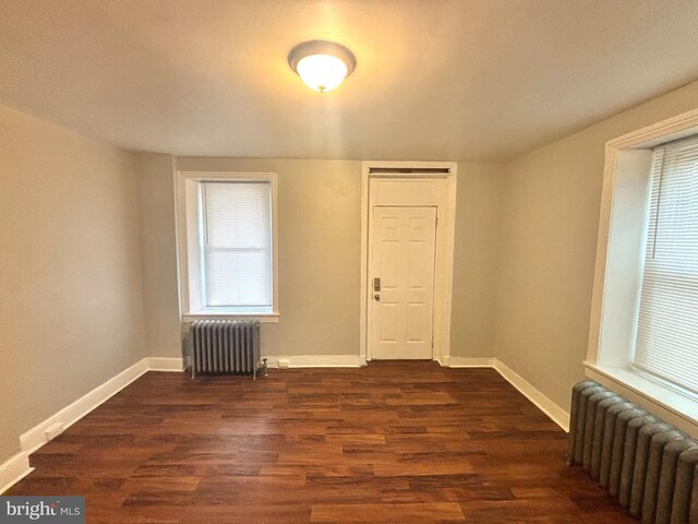 5803 Old Second St, Philadelphia, PA 19120 - empty room with radiator and dark wood-style flooring
