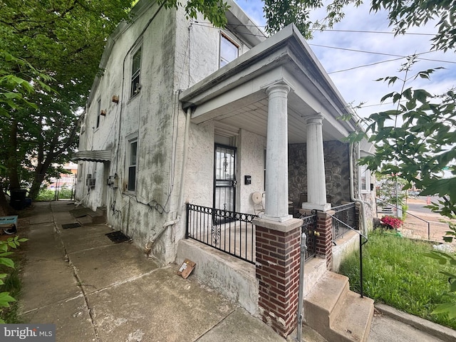 5803 Old Second St, Philadelphia, PA 19120 - view of front of house with stucco siding and a porch