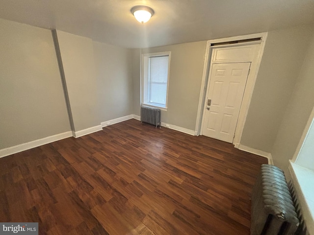 5803 Old Second St, Philadelphia, PA 19120 - spare room featuring radiator and dark wood finished floors