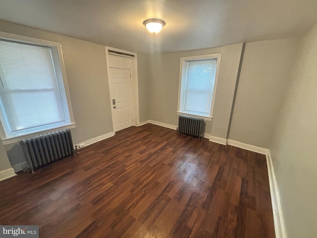 5803 Old Second St, Philadelphia, PA 19120 - spare room with radiator and dark wood-type flooring
