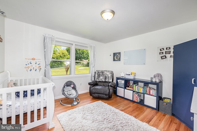 3508 Garrett Ct, Aberdeen, MD 21001 - bedroom featuring wood finished floors and a nursery area
