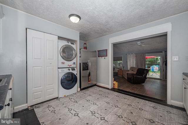 100 Garrett Rd, Glen Burnie, MD 21060 - laundry area with stacked washer / dryer, a textured ceiling, and a ceiling fan