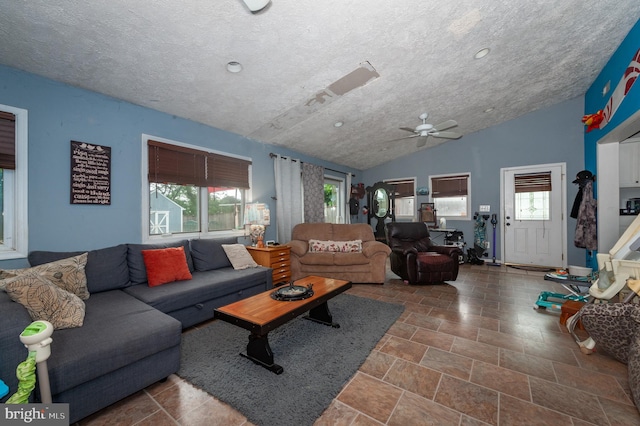 100 Garrett Rd, Glen Burnie, MD 21060 - living area featuring vaulted ceiling, plenty of natural light, a ceiling fan, stone finish flooring, and recessed lighting