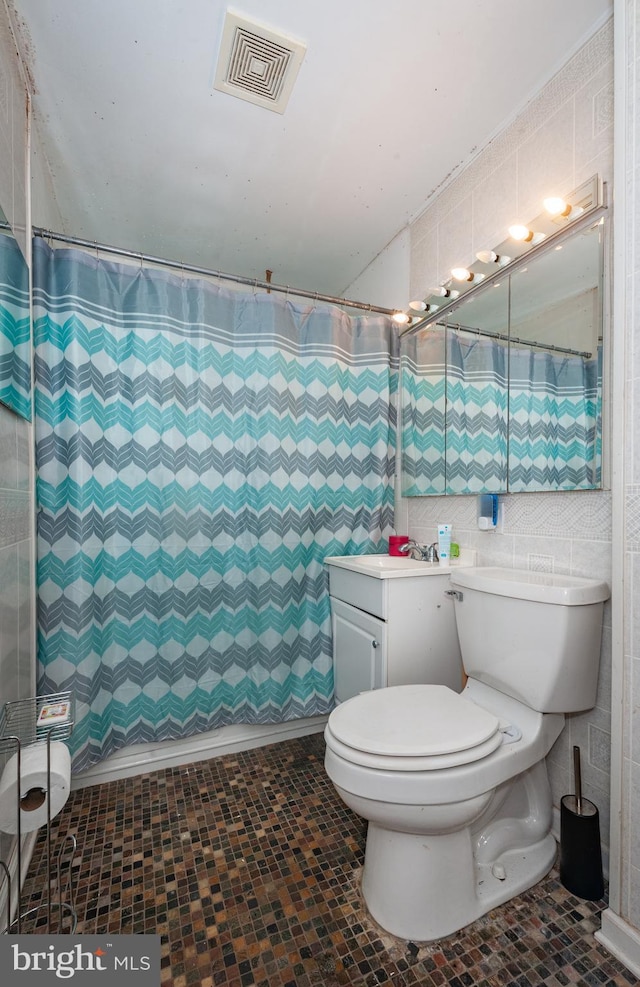 100 Garrett Rd, Glen Burnie, MD 21060 - bathroom with tile walls, vanity, and curtained shower
