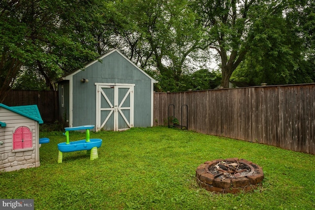 100 Garrett Rd, Glen Burnie, MD 21060 - view of shed featuring an outdoor fire pit and a fenced backyard