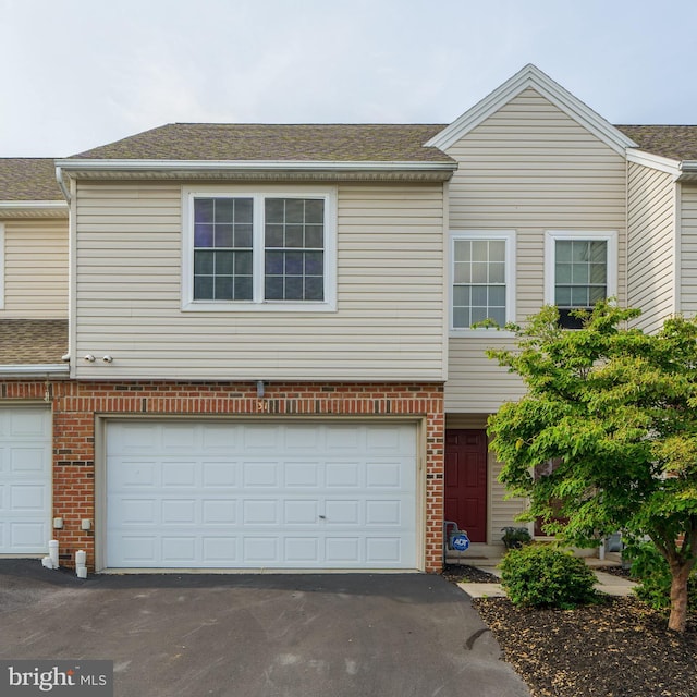 2312 Slater Hill Ln E Unit 62, York, PA 17406 - townhome / multi-family property featuring asphalt driveway, an attached garage, and brick siding