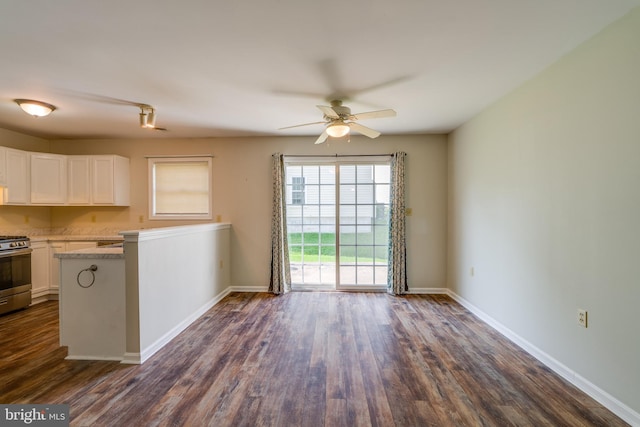 2312 Slater Hill Ln E Unit 62, York, PA 17406 - kitchen with stainless steel range with gas stovetop, white cabinetry, dark wood finished floors, and ceiling fan