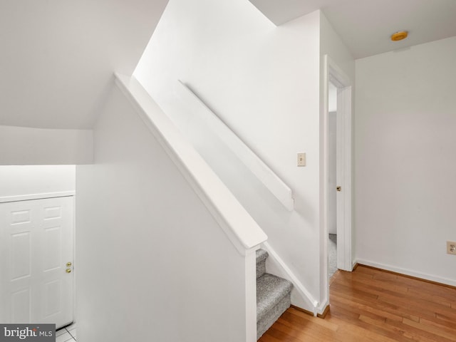 398 Lynetree Dr Unit 11-D, West Chester, PA 19380 - stairway with hardwood / wood-style flooring and baseboards
