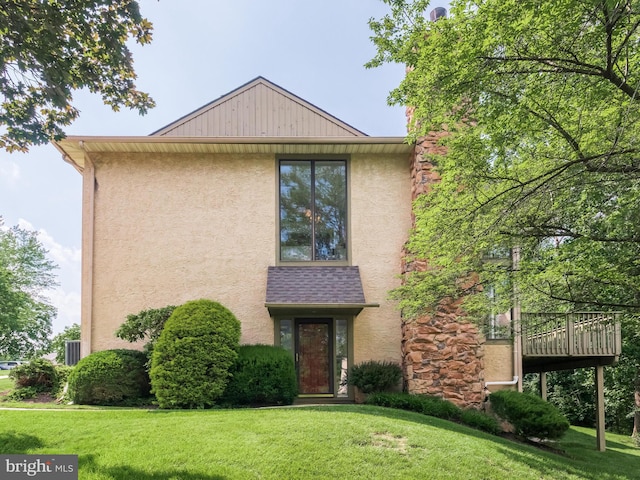 398 Lynetree Dr Unit 11-D, West Chester, PA 19380 - view of front of house featuring a front yard and stucco siding