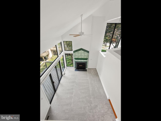 398 Lynetree Dr Unit 11-D, West Chester, PA 19380 - unfurnished living room featuring a ceiling fan, carpet floors, high vaulted ceiling, and a tile fireplace