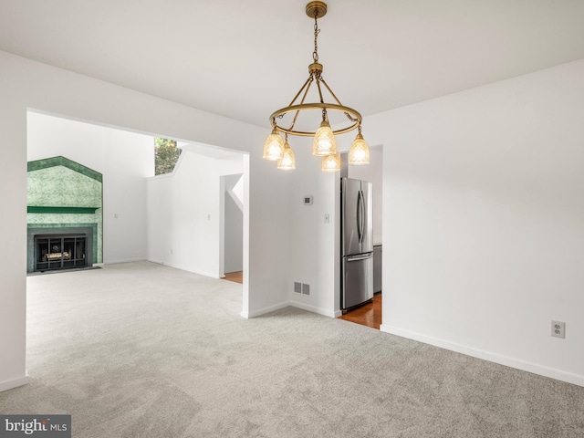 398 Lynetree Dr Unit 11-D, West Chester, PA 19380 - unfurnished living room featuring carpet flooring and a fireplace with flush hearth