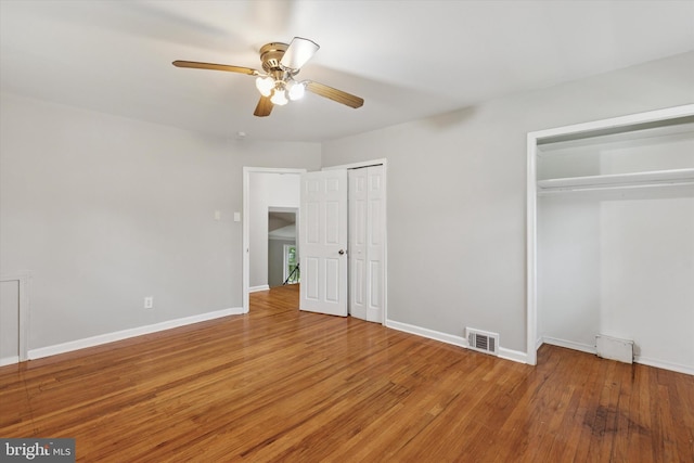 209 Riverview Rd, King Of Prussia, PA 19406 - unfurnished bedroom featuring multiple closets, light wood finished floors, and ceiling fan