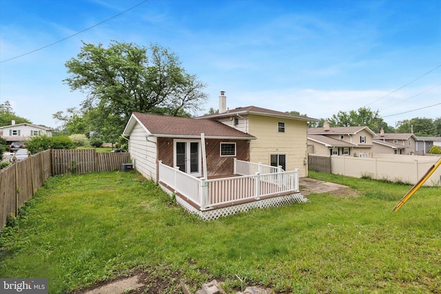 209 Riverview Rd, King Of Prussia, PA 19406 - rear view of house featuring a deck, a fenced backyard, and a chimney