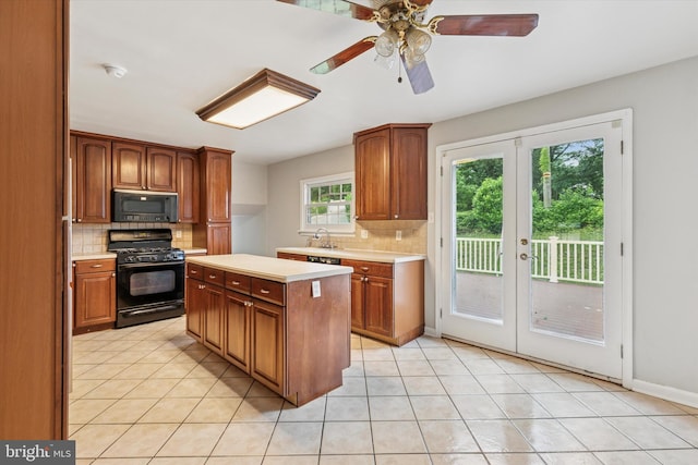 209 Riverview Rd, King Of Prussia, PA 19406 - kitchen with black appliances, french doors, light countertops, and tasteful backsplash