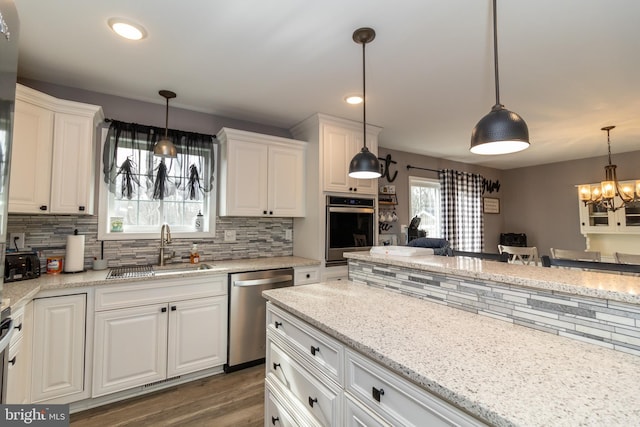 5 N Edinburgh Ct, Houston, DE 19954 - kitchen featuring stainless steel appliances, a chandelier, backsplash, white cabinets, and recessed lighting
