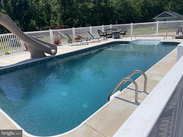 5 N Edinburgh Ct, Houston, DE 19954 - view of swimming pool with a water slide and a patio
