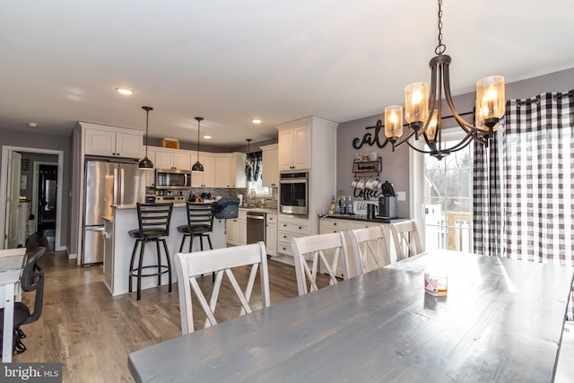 5 N Edinburgh Ct, Houston, DE 19954 - dining area featuring a chandelier, plenty of natural light, wood finished floors, and recessed lighting