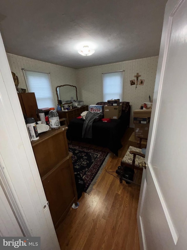 339 W Brookhaven Rd, Brookhaven, PA 19015 - bedroom with wood finished floors, wallpapered walls, and multiple windows