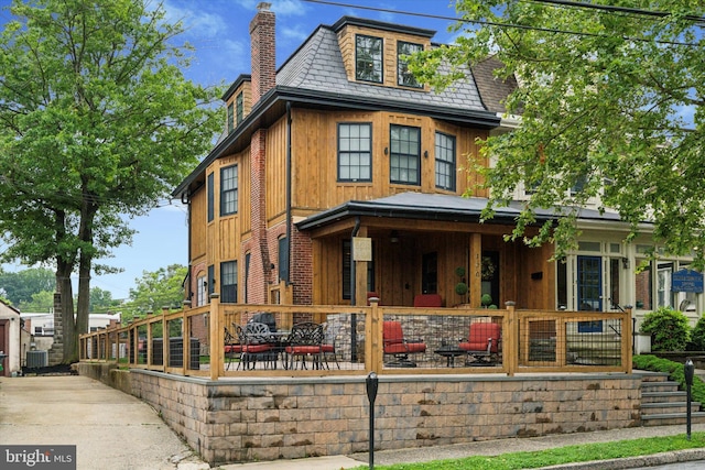 130 E State St, Media, PA 19063 - view of front of home with a porch, a chimney, and board and batten siding