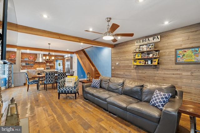 130 E State St, Media, PA 19063 - living area with wood walls, a ceiling fan, recessed lighting, wood finished floors, and stairs