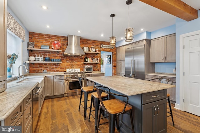130 E State St, Media, PA 19063 - kitchen featuring open shelves, wall chimney range hood, high quality appliances, a kitchen breakfast bar, and dark wood-style floors
