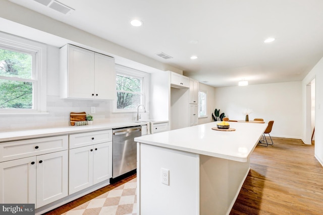 406 Christian Ln, Wallingford, PA 19086 - kitchen with dishwasher, light wood-style flooring, a center island, recessed lighting, and white cabinetry