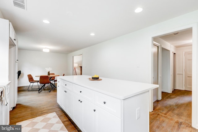 406 Christian Ln, Wallingford, PA 19086 - kitchen featuring light wood finished floors, a kitchen island, light countertops, white cabinetry, and recessed lighting
