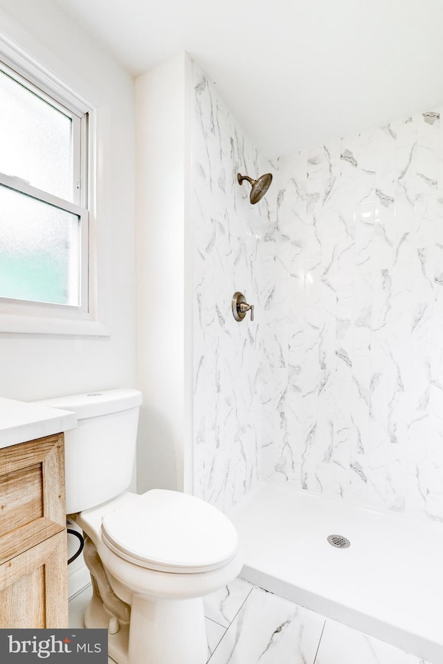 406 Christian Ln, Wallingford, PA 19086 - bathroom with marble finish flooring, a stall shower, and vanity