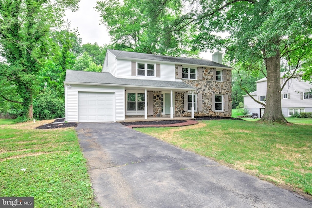 406 Christian Ln, Wallingford, PA 19086 - view of front of property with an attached garage, stone siding, asphalt driveway, a chimney, and a porch