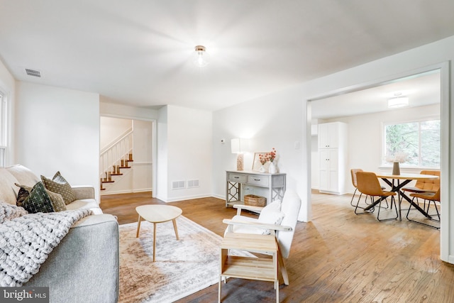 406 Christian Ln, Wallingford, PA 19086 - living area featuring light wood-style floors and stairway