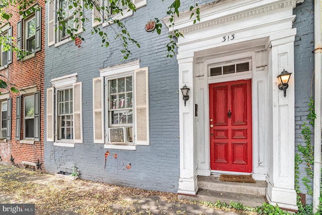 313 E Main St, Mechanicsburg, PA 17055 - doorway to property with brick siding and cooling unit