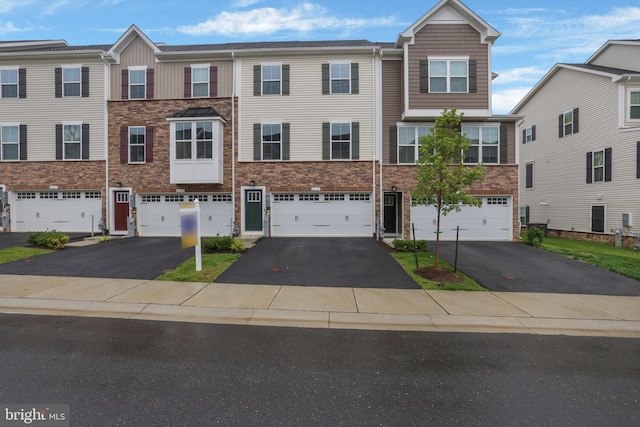 8109 Primrose Ln, Laurel, MD 20723 - multi unit property with stone siding, driveway, and a garage