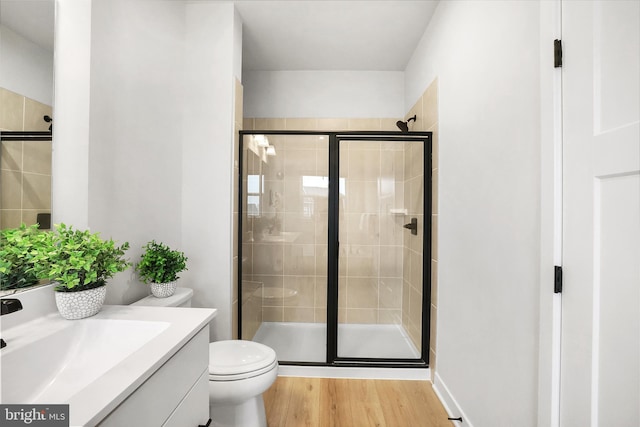8109 Primrose Ln, Laurel, MD 20723 - bathroom featuring vanity, a stall shower, and wood finished floors