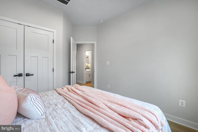 8109 Primrose Ln, Laurel, MD 20723 - bedroom featuring a closet and wood finished floors