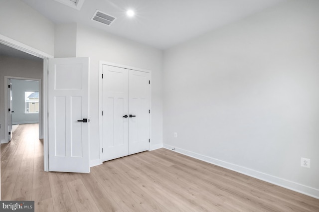 8109 Primrose Ln, Laurel, MD 20723 - unfurnished bedroom featuring light wood-type flooring and a closet