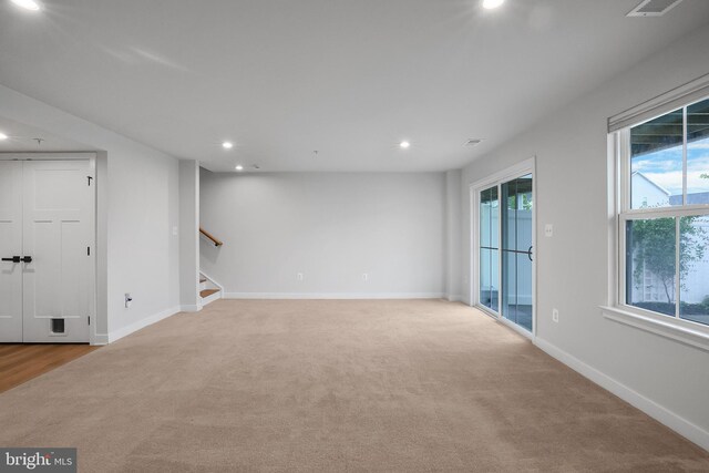 8109 Primrose Ln, Laurel, MD 20723 - unfurnished room featuring light colored carpet, recessed lighting, and stairway