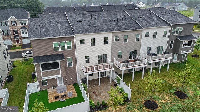 8109 Primrose Ln, Laurel, MD 20723 - rear view of house with a fenced backyard, a residential view, and a patio